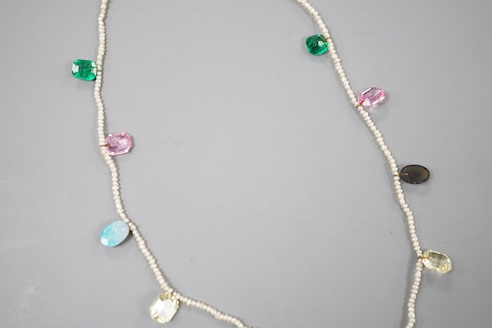 A multi coloured paste and opal doublet set baroque seed pearl necklace, 42cm.